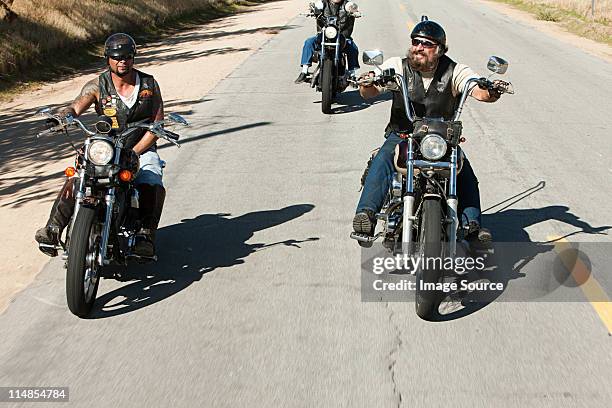 Man Riding Motorcycle Through Desert Photos and Premium High Res ...