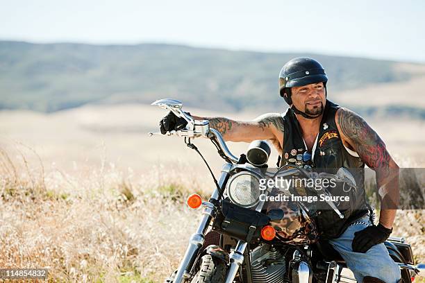 portrait of man parked on motorcycle - cool man leather bildbanksfoton och bilder