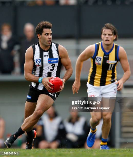 Daniel Wells of Collingwood runs with the ball during the round six VFL match between Collingwood and Sandringham at Victoria Park on May 12, 2019 in...