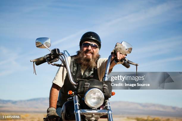 portrait of senior motorcyclist - old man on motor bike stock pictures, royalty-free photos & images