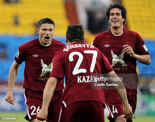 Aleksei Medvedev , Salvatore Bocchetti and Cesar Navas of FC Rubin Kazan celebrate after scoring a goal during the Russian Football League...