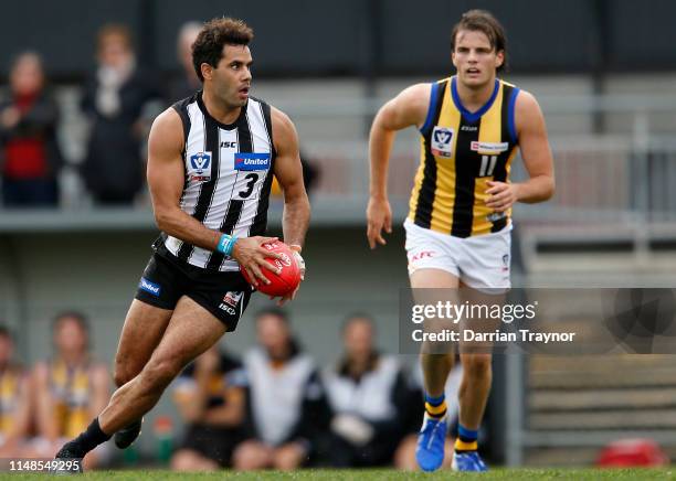 Daniel Wells of Collingwood runs with the ball during the round six VFL match between Collingwood and Sandringham at Victoria Park on May 12, 2019 in...