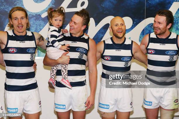 Mitch Duncan of the Cats sing the club song after winning with his chils and teammates during the round eight AFL match between the North Melbourne...