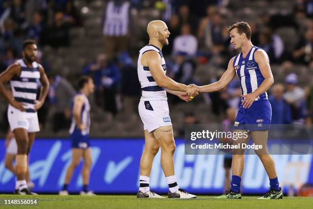 Victorious comes up to Gary Ablett of the Cats after taunting Kayne Turner of the Kangaroos earlier when kicking a goal during the round eight AFL...