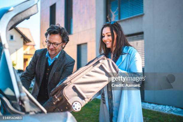 People Loading Luggage 42 Laughing Friends Loading Luggage Into Car Stock Photos, High-Res ...