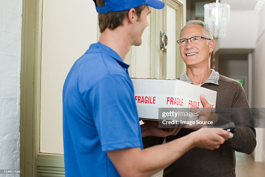 Delivery man delivering parcel