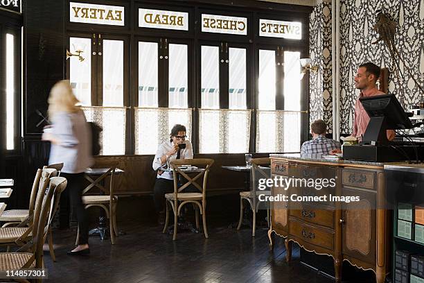 people in cafe - waiter new york stock pictures, royalty-free photos & images