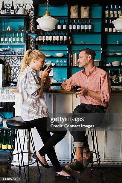 couple at coffee bar - hair color saloon stockfoto's en -beelden