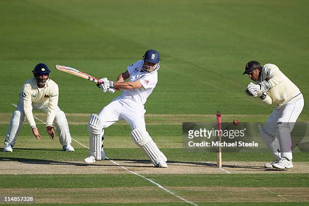 Andrew Strauss of England hits to the offside as wicketkeeper Prasanna Jayawardene and Rangana Herath look on during day two of the 1st npower test...