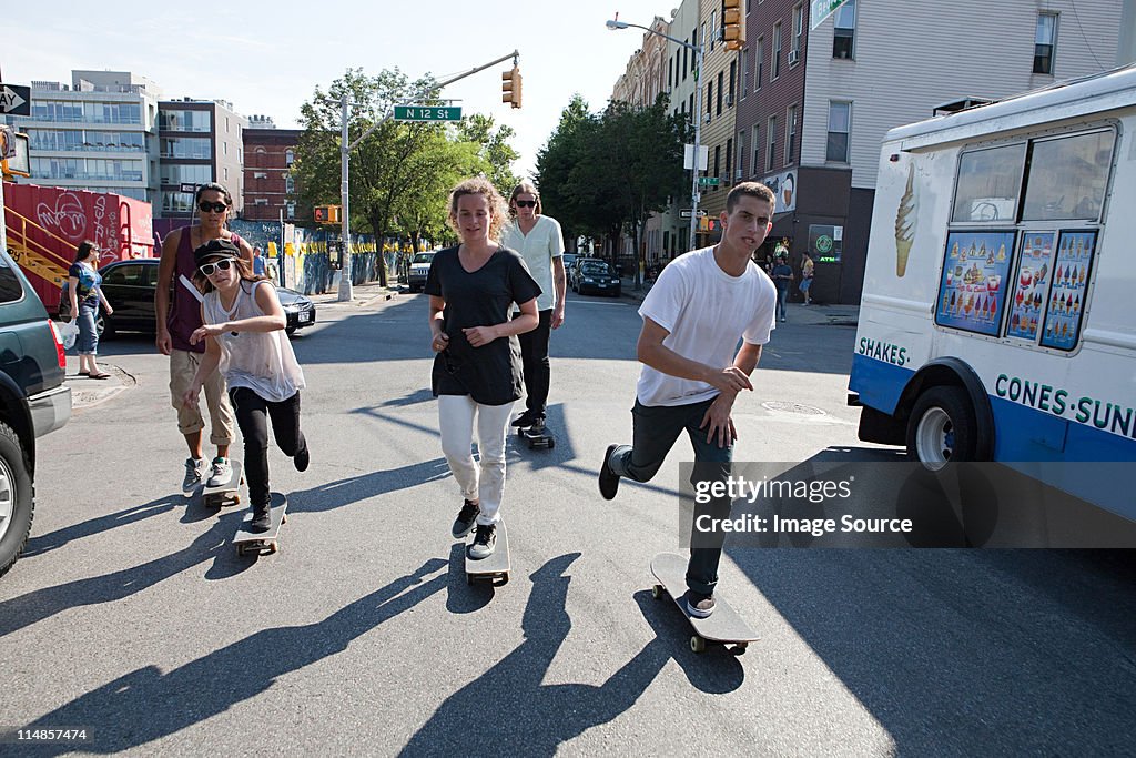 Skateboarders on urban street
