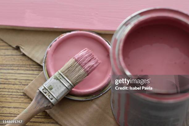 pink paint can with brush on pink background - ペンキ缶 ストックフォトと画像