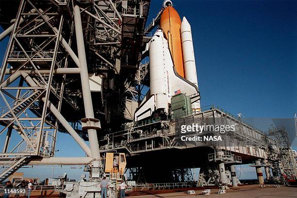 The Service Structure driver begins rolling back the Rotating Service Structure on Launch Pad 39A to reveal the Space Shuttle Endeavour with its...