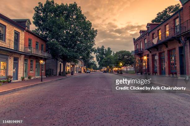 colorful sunset over historic district of saint charles missouri - missouri stock pictures, royalty-free photos & images