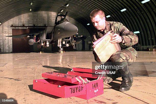 Staff Sgt. William Roop, F-15E Strike Eagle crew chief, inspects his toolbox while awaiting aircrews before launch from Incirlik Air Base, Turkey...