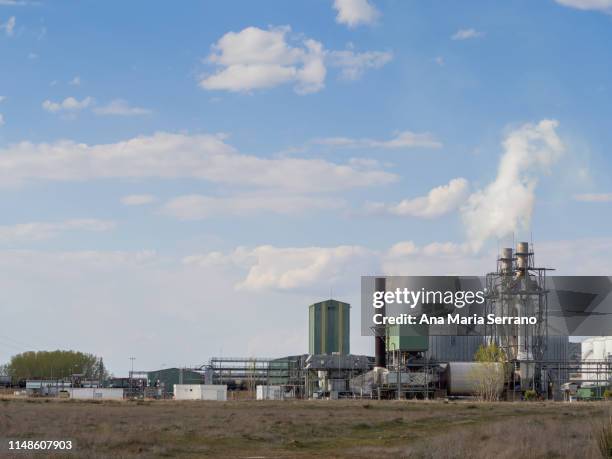 one biodiesel factory in countryside with smoke rising from the chimney - biodiesel stock pictures, royalty-free photos & images