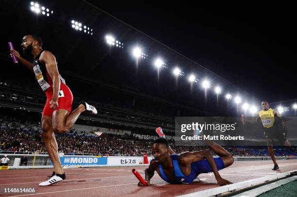 Paul Dedewo of USA falls at the finish of the Men's 4x400m Relay Final on day two of the IAAF World Relays at Nissan Stadium on May 12, 2019 in...