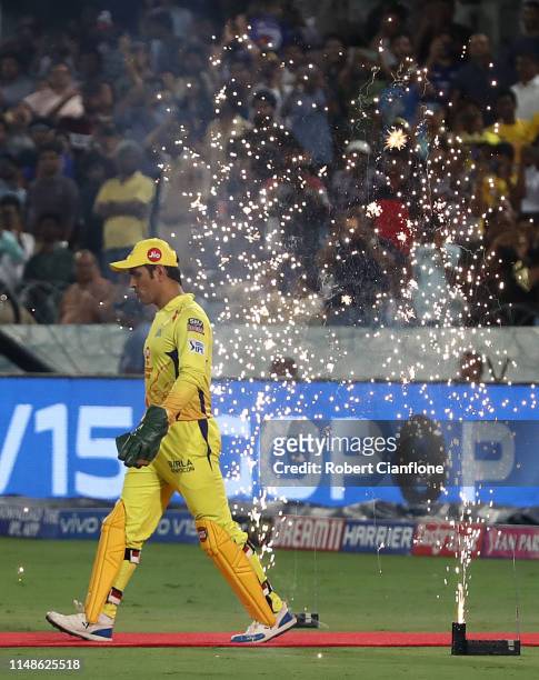 Dhoni of the Chennai Super Kings heads out to field during the Indian Premier League Final match between the the Mumbai Indians and Chennai Super...