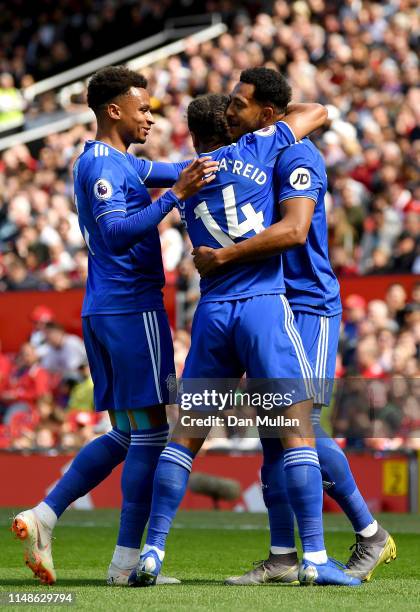 Nathaniel Mendez-Laing of Cardiff City celebrates with teammates after scoring his team's first goal during the Premier League match between...