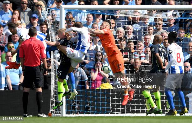 Glenn Murray of Brighton and Hove Albion scores his team's first goal during the Premier League match between Brighton & Hove Albion and Manchester...