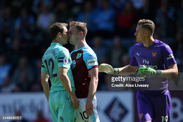 Stephan Lichtsteiner of Arsenal clashes with Ashley Barnes of Burnley during the Premier League match between Burnley FC and Arsenal FC at Turf Moor...