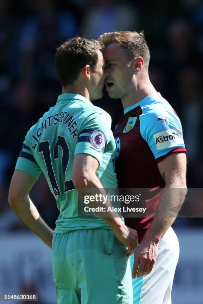 Stephan Lichtsteiner of Arsenal clashes with Ashley Barnes of Burnley during the Premier League match between Burnley FC and Arsenal FC at Turf Moor...