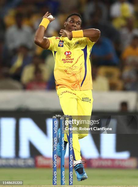 Dwayne Bravo of the Chennai Super Kings bowls during the Indian Premier League Final match between the the Mumbai Indians and Chennai Super Kings at...