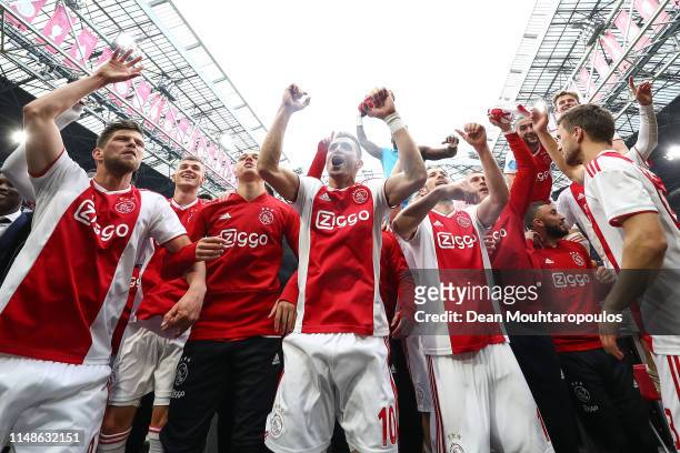 Ajax players celebrate winning the Eredivisie title at the end of the Eredivisie match between Ajax and Utrecht at Johan Cruyff Arena on May 12, 2019...