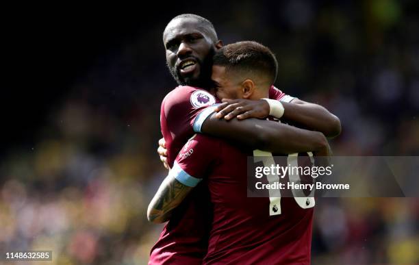 Manuel Lanzini of West Ham United celebrates with teammate Arthur Masuaku after scoring his team's second goal during the Premier League match...