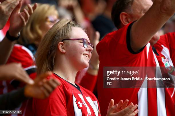Southampton fan claps as Nathan Redmond scores during the Premier League match between Southampton FC and Huddersfield Town at St Mary's Stadium on...