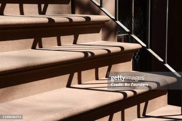 brownstone steps to a townhouse in midtown manhattan, nyc - front stoop stock pictures, royalty-free photos & images