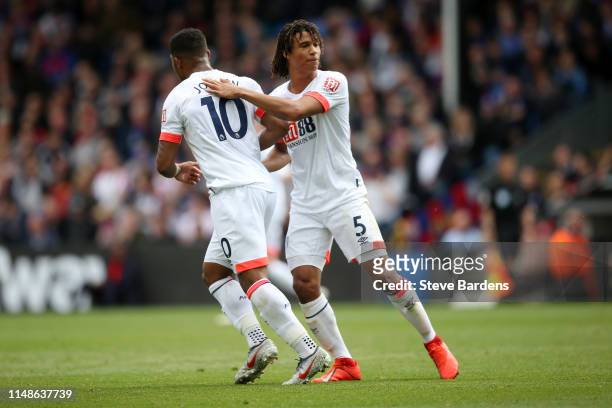 Jordon Ibe of AFC Bournemouth celebrates with teammate Nathan Ake after scoring his team's second goal during the Premier League match between...