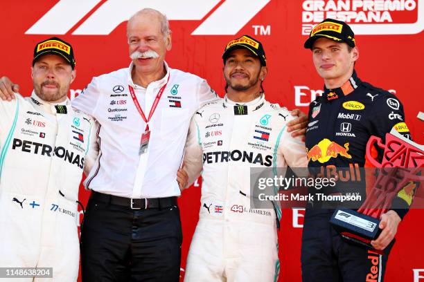 Top three finishers Lewis Hamilton of Great Britain and Mercedes GP, Valtteri Bottas of Finland and Mercedes GP and Max Verstappen of Netherlands and...