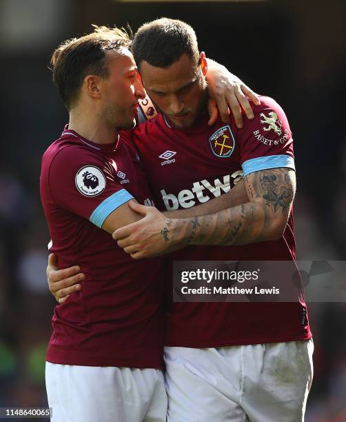 Marko Arnautovic of West Ham United congratulates Mark Noble of West Ham United on his second goal during the Premier League match between Watford FC...