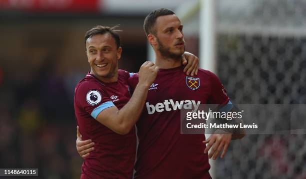 Marko Arnautovic of West Ham United congratulates Mark Noble of West Ham United on his second goal during the Premier League match between Watford FC...
