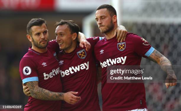 Mark Noble of West Ham United is congratulated on his second goal during the Premier League match between Watford FC and West Ham United at Vicarage...