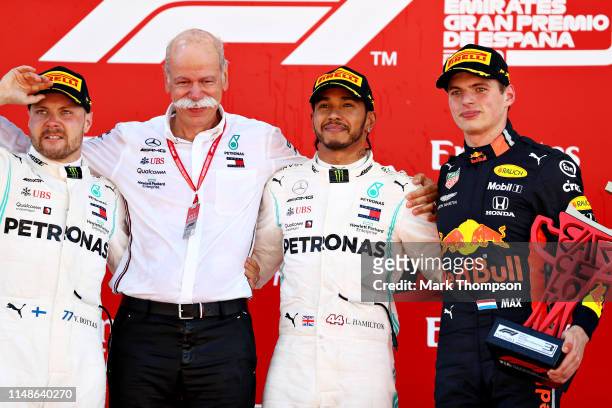 Top three finishers Lewis Hamilton of Great Britain and Mercedes GP, Valtteri Bottas of Finland and Mercedes GP and Max Verstappen of Netherlands and...