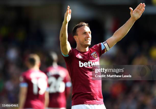 Mark Noble of West Ham United thanks the travelling supporters, after scoring his second goal during the Premier League match between Watford FC and...