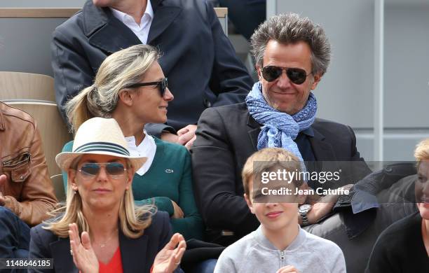 Anne-Sophie Lapix and husband Arthur Sadoun attend the women's final during day 14 of the 2019 French Open at Roland Garros stadium on June 8, 2019...