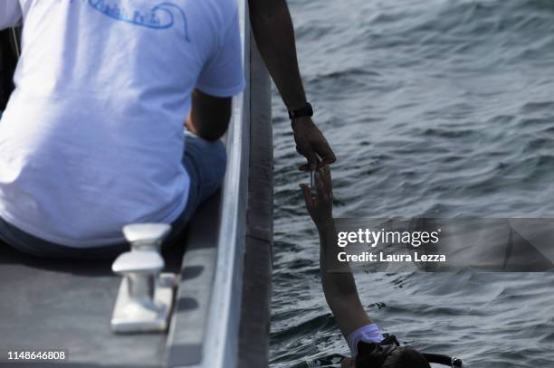 Researchers of the Institute of BioRobotics of the Scuola Superiore Sant'Anna di Pisa collect samples from the Crab Robot during its first dive in...