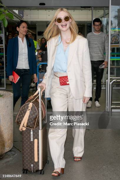 Actress Elle Fanning arrives ahead of the 72nd annual Cannes Film Festival at Nice Airport on May 12, 2019 in Nice, France.
