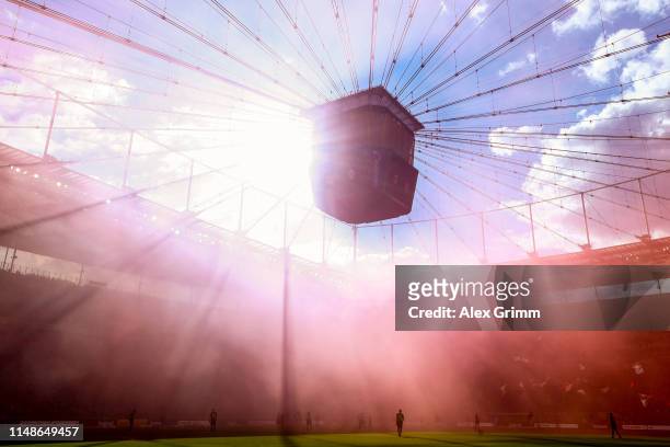 General view of the action as purple smoke from flares fills the air during the Bundesliga match between Eintracht Frankfurt and 1. FSV Mainz 05 at...