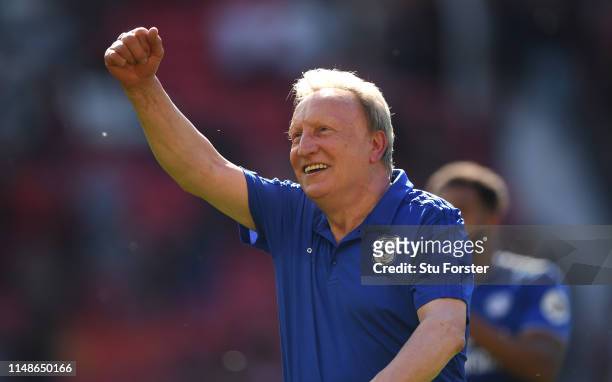 Cardiff manager Neil Warnock celebrates with the fans after the Premier League match between Manchester United and Cardiff City at Old Trafford on...