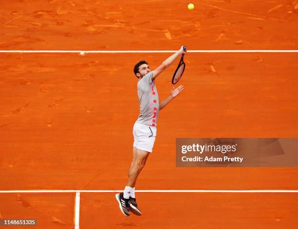 Simon Gilles of France hits a backhand to Philipp Kohlschreiber of Germany on day 1 of the Internazionali BNL d'Italia at Foro Italico on May 12,...