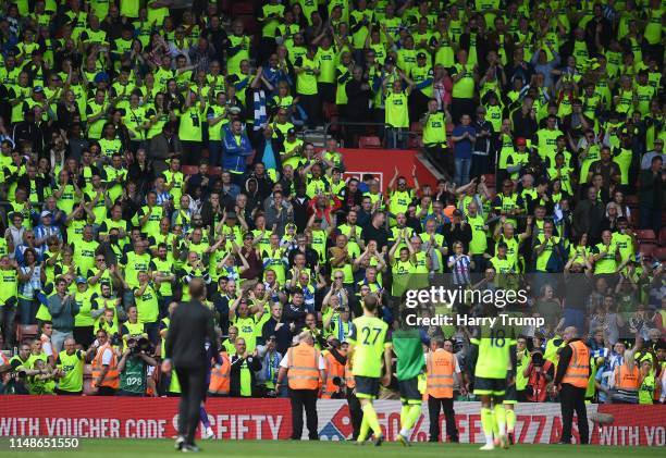 The Huddersfield side applaud the fans at the final whistle during the Premier League match between Southampton FC and Huddersfield Town at St Mary's...
