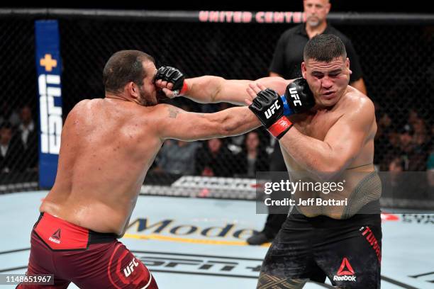 Tai Tuivasa of Australia and Blagoy Ivanov of Bulgaria exchange punches in their heavyweight bout during the UFC 238 event at the United Center on...