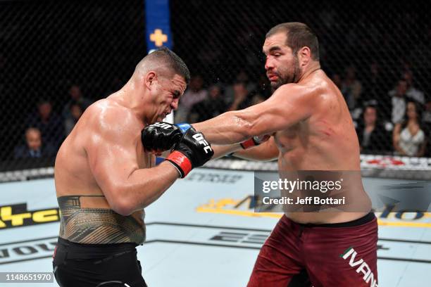 Blagoy Ivanov of Bulgaria punches Tai Tuivasa of Australia in their heavyweight bout during the UFC 238 event at the United Center on June 8, 2019 in...