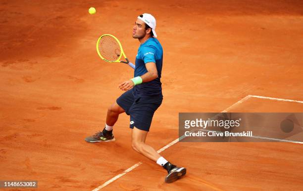 Matteo Berrettini of Italy plays a forehand against against Lucas Pouille of France in their first round match during day one of the Internazionali...