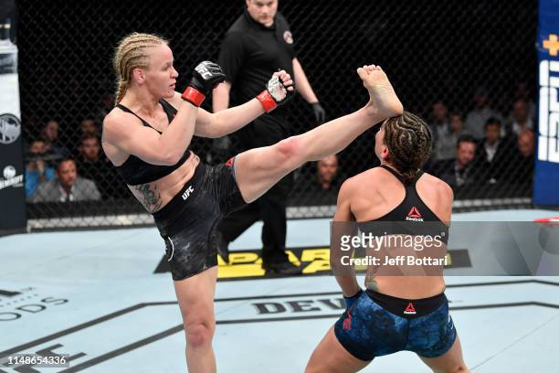 Valentina Shevchenko of Kyrgyzstan knocks out Jessica Eye in their women's flyweight championship bout during the UFC 238 event at the United Center...