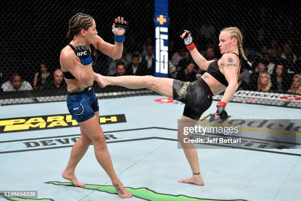 Valentina Shevchenko of Kyrgyzstan kicks Jessica Eye in their women's flyweight championship bout during the UFC 238 event at the United Center on...