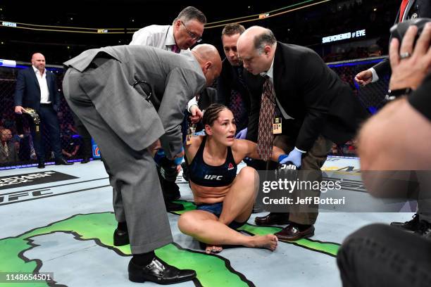 Jessica Eye reacts after her KO loss to Valentina Shevchenko of Kyrgyzstan in their women's flyweight championship bout during the UFC 238 event at...